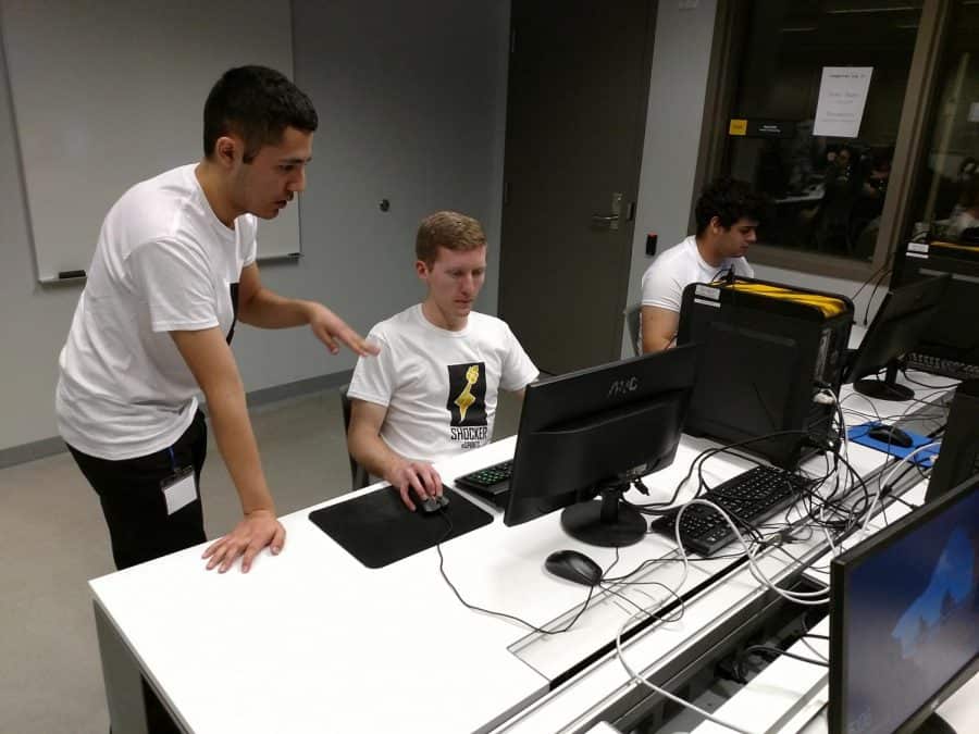 Members of Wichita States League of Legends team, Alpha Shocks, warm up before a tournament held at the Experiential Engineering Building. Left to right: Julio Banuelos, Dylan Victor, Chandler Hoskins. (2017)