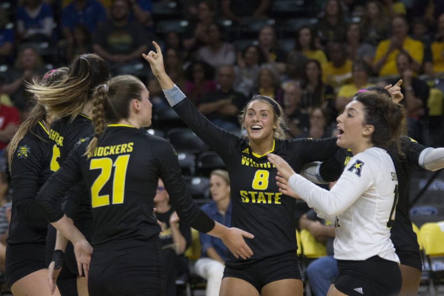Wichita State volleyball celebrates after scoring against Memphis. 