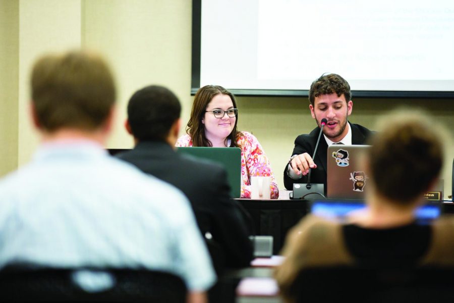 Student Body Vice President Shelby Rowell (left) and Chief of Operations Matthew Madden lead a Student Government meeting Wednesday evening. The Student Senate voted unanimously to allocate around $2,600 to buy three new laptops.