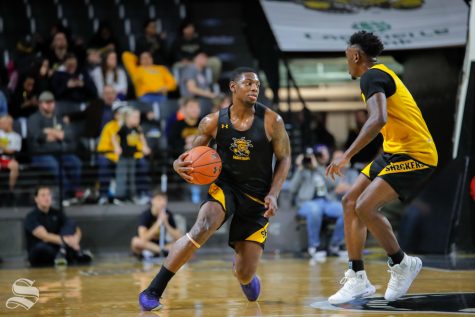 Wichita State's Jamarius Burton dribbles during the Black and Yellow Scrimmage at Koch Arena on Oct. 6, 2018.