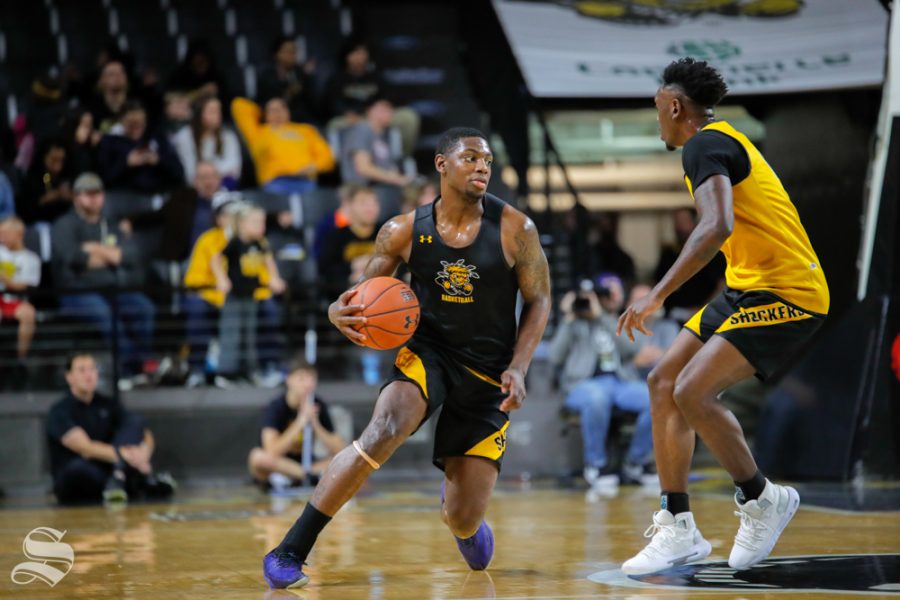 Wichita States Jamarius Burton dribbles during the Black and Yellow Scrimmage at Koch Arena on Oct. 6, 2018.
