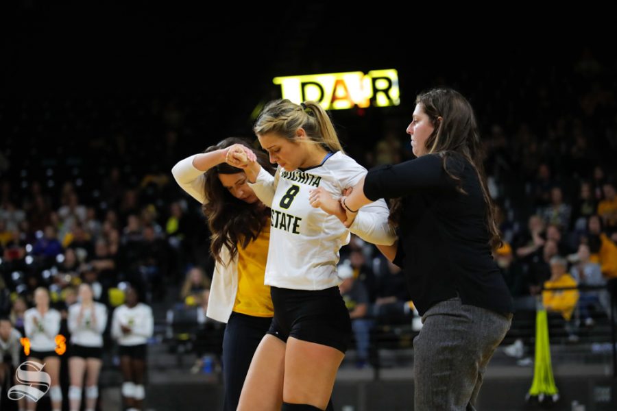 Wichita State's Kali Eaken gets helped off the court during their game against ECU on Oct. 12, 2018 at Koch Arena.