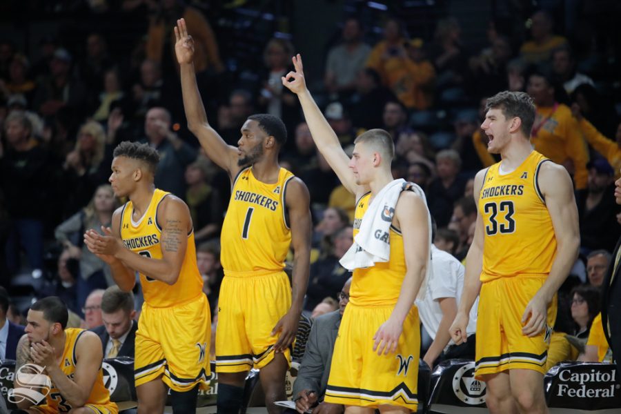 Wichita States bench cheers on their teammates after a three point basket. The Shockers won their game 75-64 on Oct. 30, 2018 in Koch Arena.