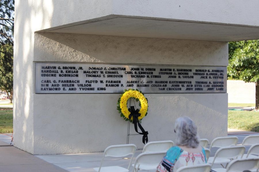 A+wreath+is+placed+on+Football+Memorial+70.+Family+members+of+those+who+died+in+the+plane+crash+on+Oct.+2%2C+1970%2C+place+a+wreath+on+the+memorial+each+year+to+memorialize+the+31+lives+lost+in+the+crash.+