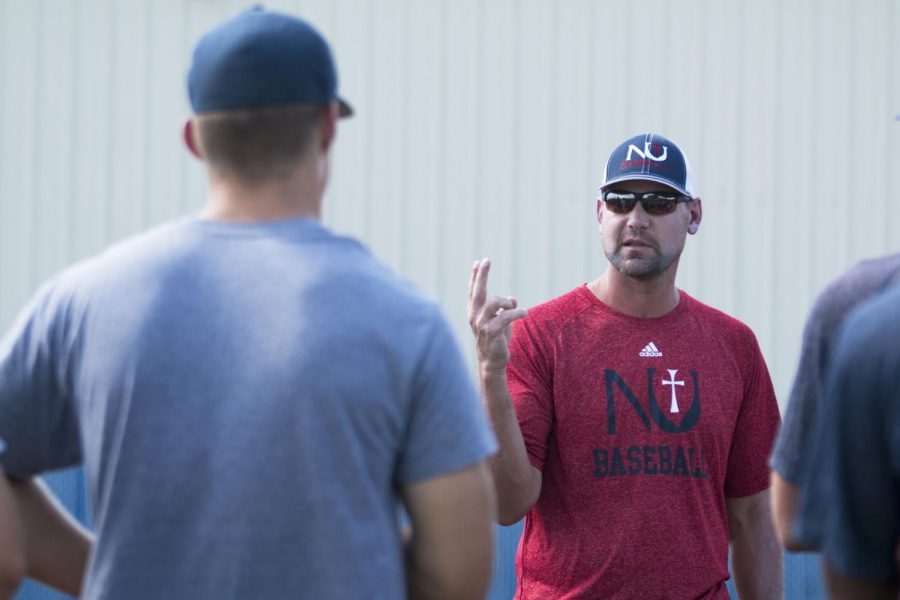 Newman University Pitching Coach Mike Pelfrey speaks to players at the beginning of practice. Pelfrey was a pitcher for Wichita State until he was drafted after his junior year in 2005. 