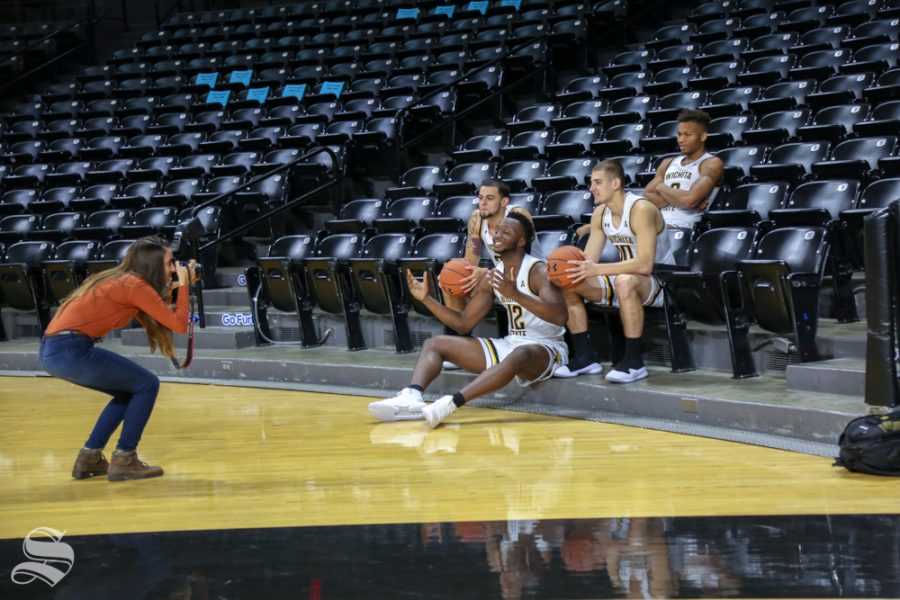 Selena Favela photographs players from the Wichita State mens basketball team during media day at Koch Arena.