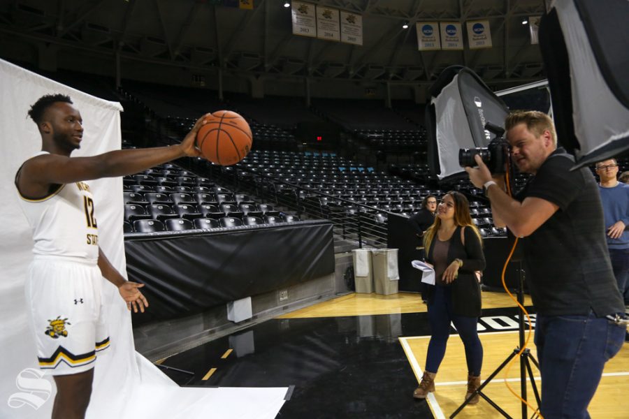 The Sunflowers Joseph Barringhaus photographs Morris Udeze during media day at Koch Arena in 2018.