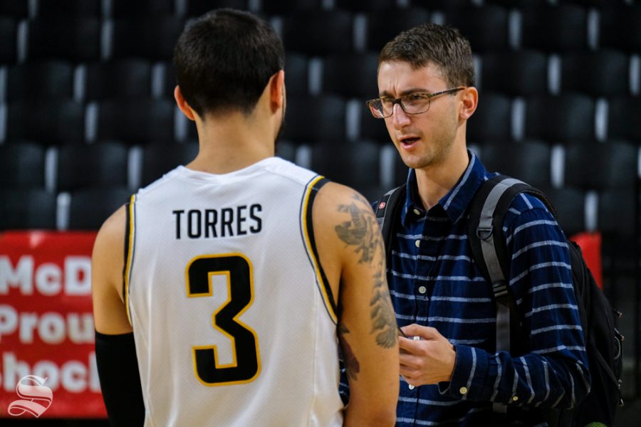 Evan Pflugradt, Sports Editor of the Sunflower, interviews Wichita State guard Ricky Torres.