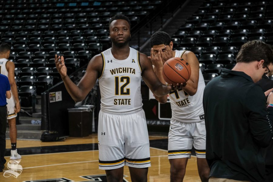 Wichita States Morris Udeze and Isaiah Poor Bear-Chandler play around while waiting for the photo session.