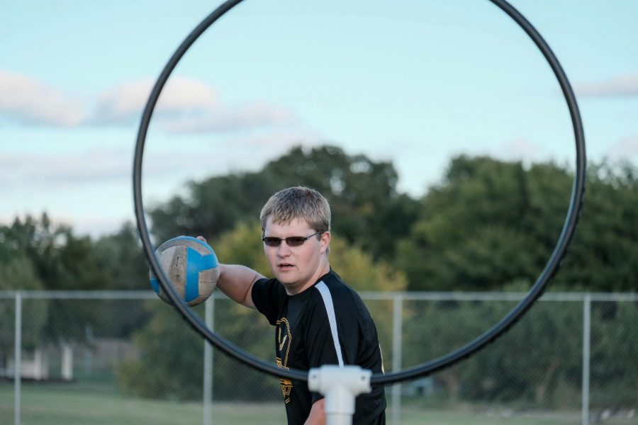 Damon Penner, a sophomore majoring in History, is the vice president of Wichita State Quidditch. He scores by throwing the quaffle ball through the hoop.