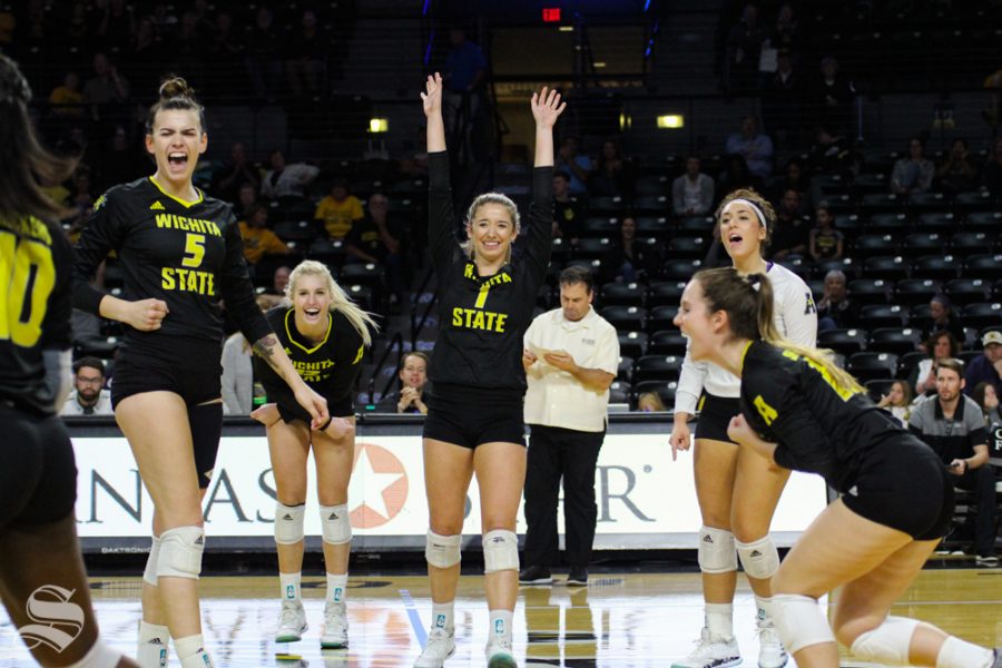 Wichita State players celebrate after a point by Tabitha Brown at their game against Temple on Oct. 28 at Koch Arena.