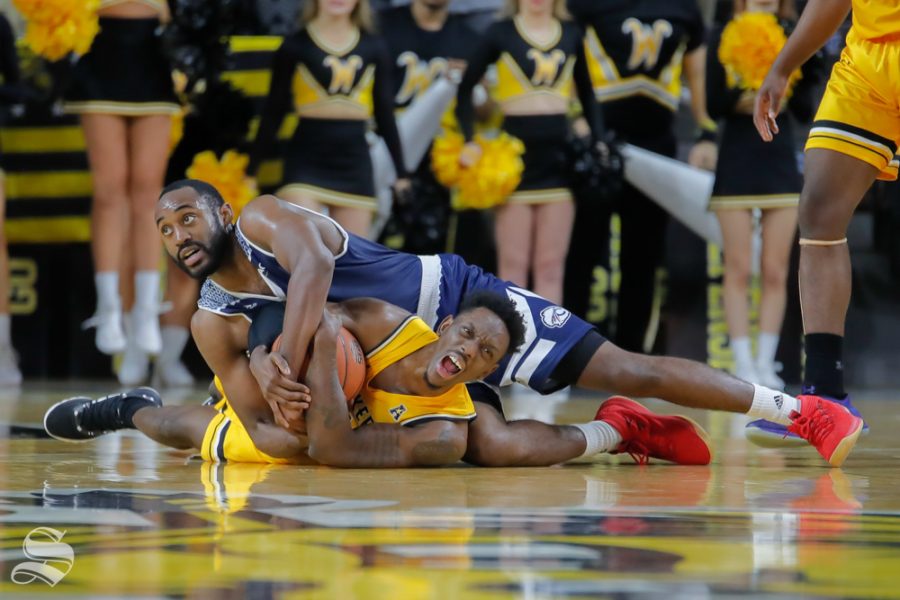 Wichita States Samajae Haynes-Jones fights for ball during their game against Catawba on Oct. 30, 2018 at Koch Arena.