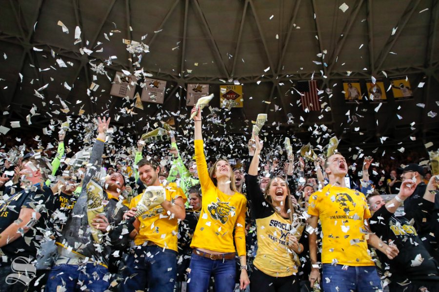 The Wichita State student section throws up pieces of The Sunflower after the first basket of the game on Nov. 6, 2018 in Koch Arena.