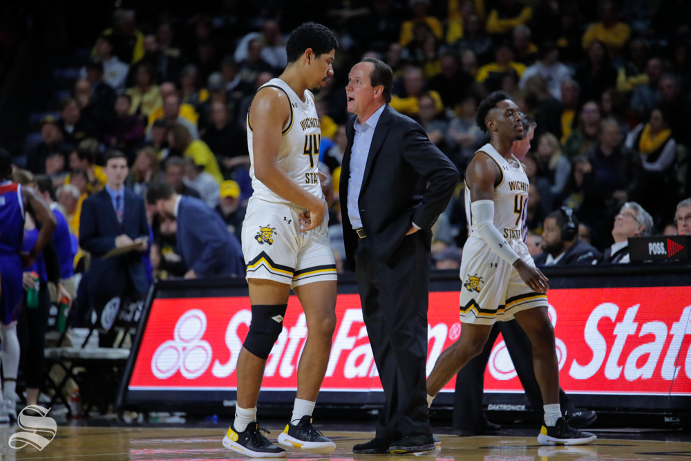 Wichita States Isaiah Poor Bear-Chandler speaks to Coach Gregg Marshall during their game against Louisiana Tech in Koch Arena on Nov. 6, 2018.