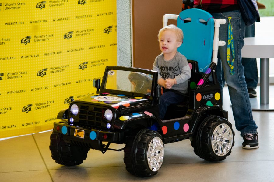 Corban Sullivan happily drives his modified battery powered vehicle at GoBabyGos Delivery and Tune Up Day on November 17 in the Experiential Engineering Building. Corbans vehicle was sponsored by TW Metals.