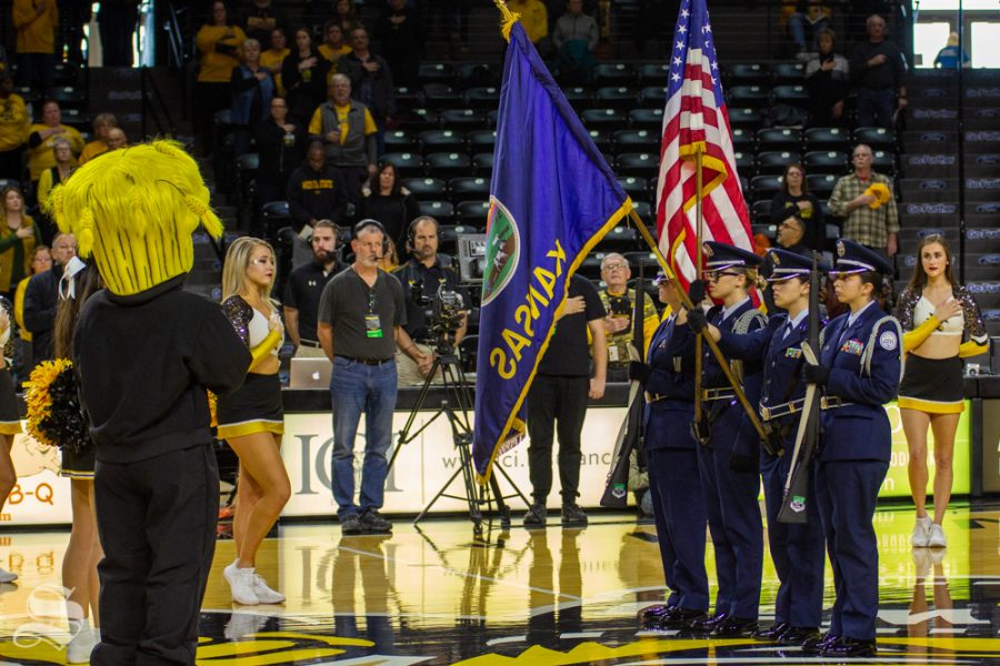 Wu looks to the flag during the national anthem at WSU's game against Missouri State on Nov. 10, 2018 in Koch arena.