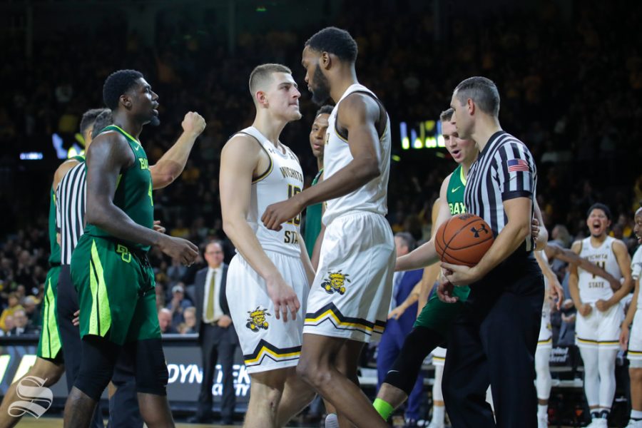 Wichita State forward Markis McDuffie celebrates with freshman Erik Stevenson during their game against Baylor in Charles Koch Arena on Dec. 1, 2018.