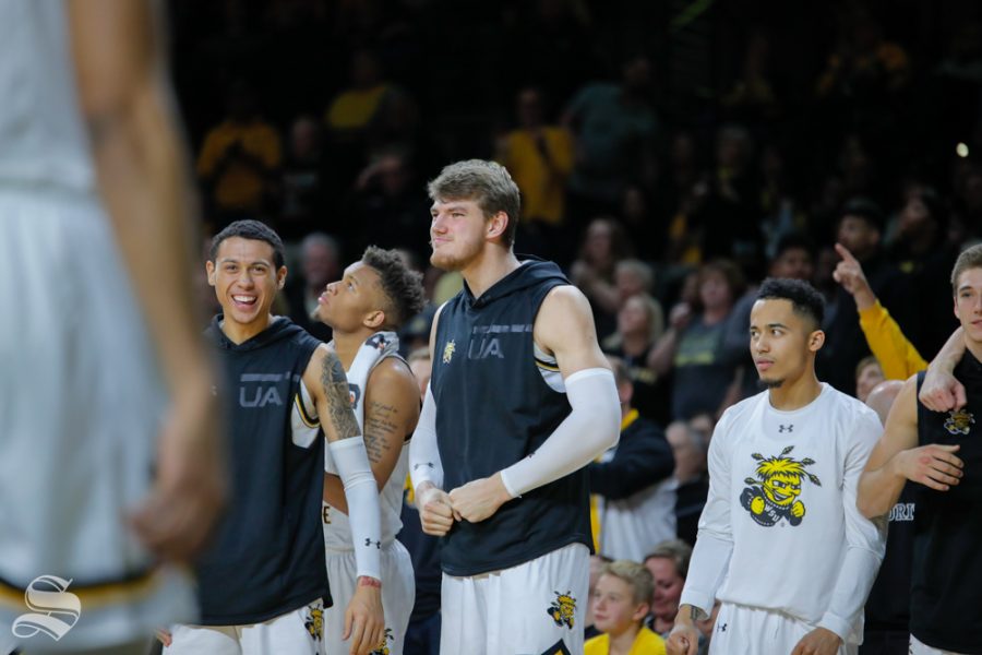 Wichita State center Asbjørn Midtgaard celebrates on the bench during their game against Baylor in Charles Koch Arena on Dec. 1, 2018.