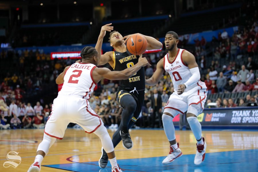 Wichita State guard Dexter Dennis gets fouled during their game against the University of Oklahoma at Chesapeake Energy Arena in Oklahoma City on Dec. 8, 2018.