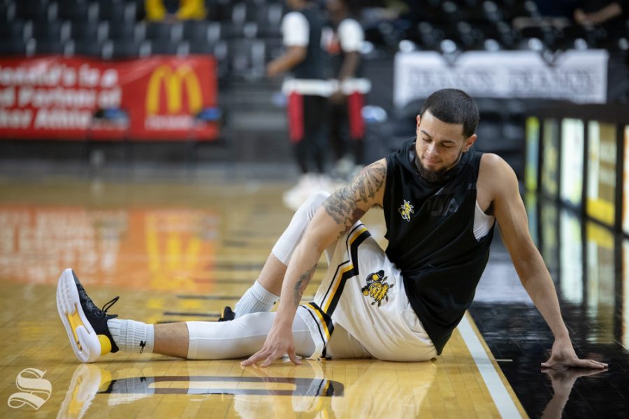 Wichita State guard Ricky Torres stretches before their game against Jacksonville State on Dec. 12, 2018 at Charles Koch Arena. (Joseph Barringhaus/The Sunflower)
