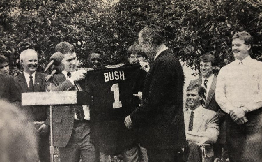 President George H.W. Bush receives his own Shocker jersey from Wichita States Greg Brummett.