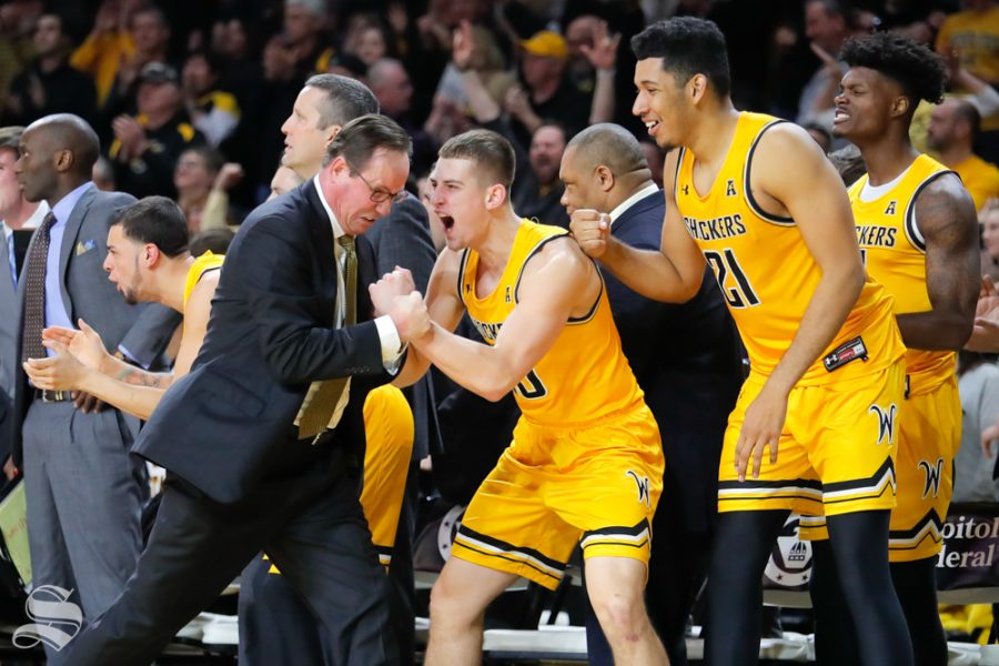 Wichita State freshman Erik Stevenson cheers with Head Coach Gregg Marshall after a play in the final seconds of their game against UCF on Jan. 16, 2019 at Charles Koch Arena.