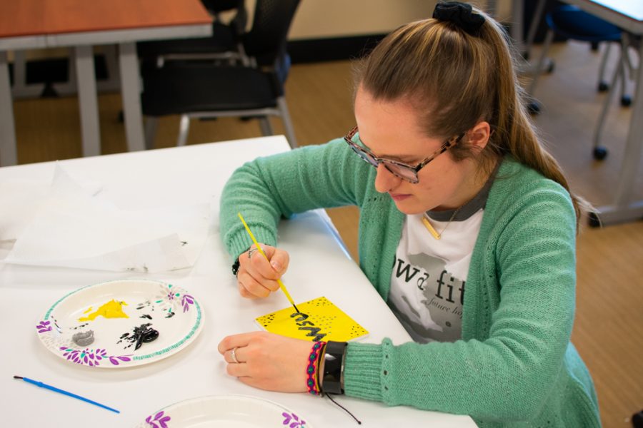 Graduate Audiology student, Shayla Ingalls, applies finishing touches to a ceramic tile during an event held in the RSC on Wednesday, January 30. The event was held by Student Affairs to help students reflect on various aspects of their academics.