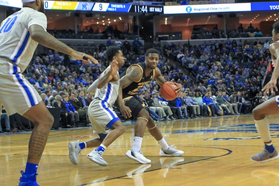 Wichita State freshman Jamarius Burton drives the basket during their game against Memphis in Memphis, Tenn. on Jan. 4, 2019. (Photo by Jerald Holiday/The Daily Helmsman)