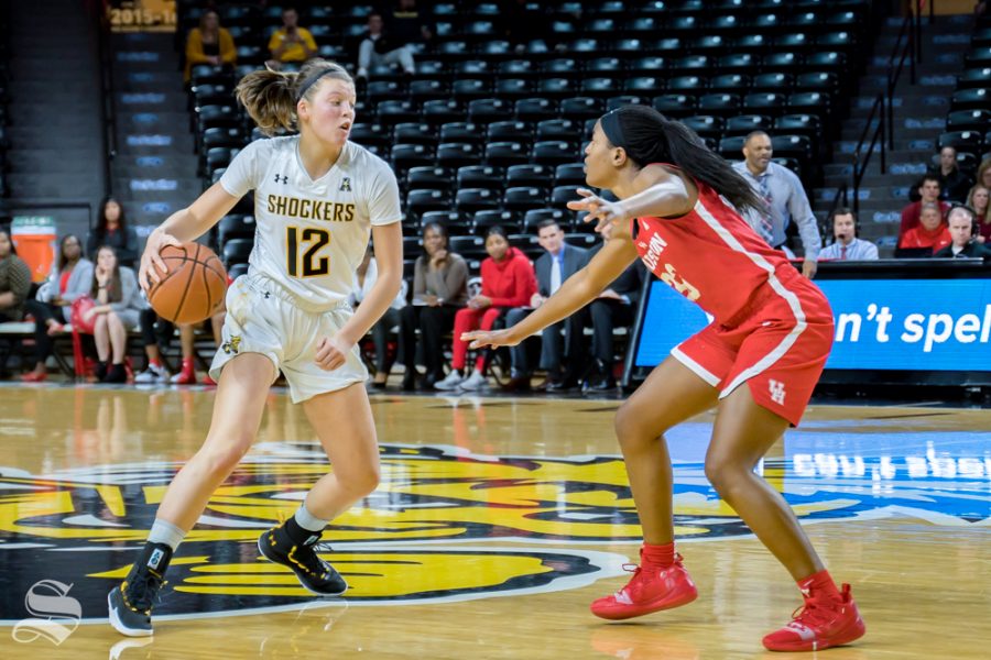 Wichita State freshman Carla Bremaud crosses a defender over during their game against Houston on Jan. 20, 2019 at Koch Arena.