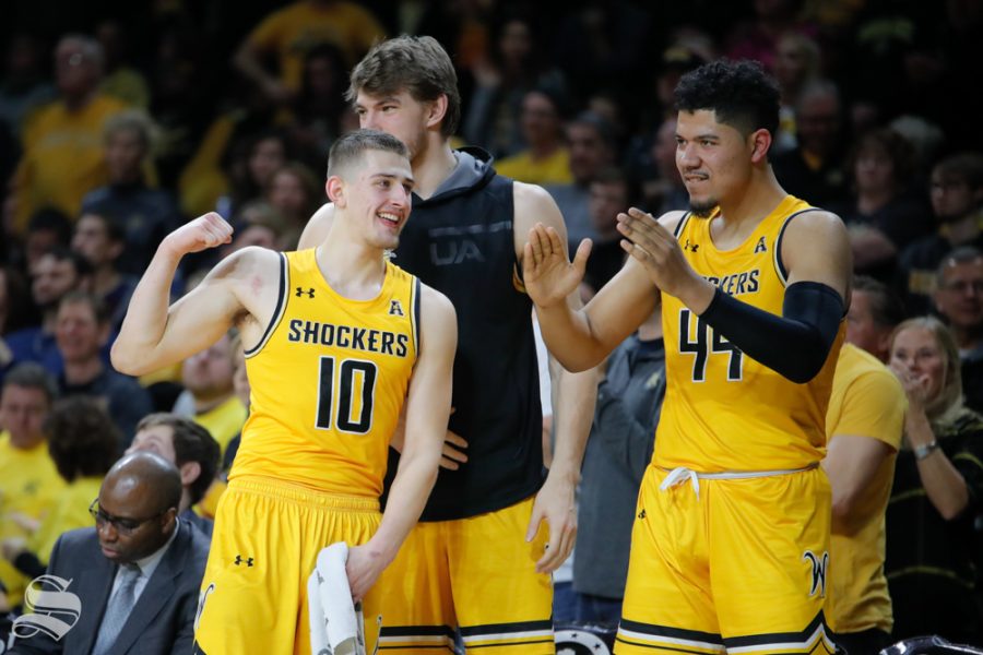 Wichita State freshman Erik Stevenson and forward Isaiah Poor Bear-Chandler celebrate after a basket is made during the game against Tulane on Feb. 9, 2019 at Charles Koch Arena. (Photo by Joseph Barringhaus/The Sunflower).