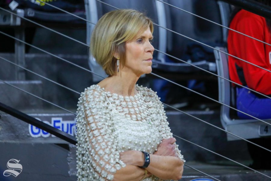 UConn associate head coach Chris Dailey watches her team warm up on February 25, 2019 inside Charles Koch Arena. 