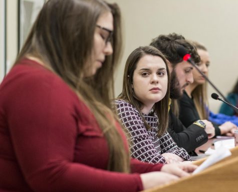 Newly sworn-in Student Body President Shelby Rowell listens to Maia Cuellar speak during open forum of the Student Senate meeting Wednesday, Feb. 13, 2019. Brinkley resigned as Student Body President Wednesday morning amid accusations that he sexually assaulted Cuellar in 2017.