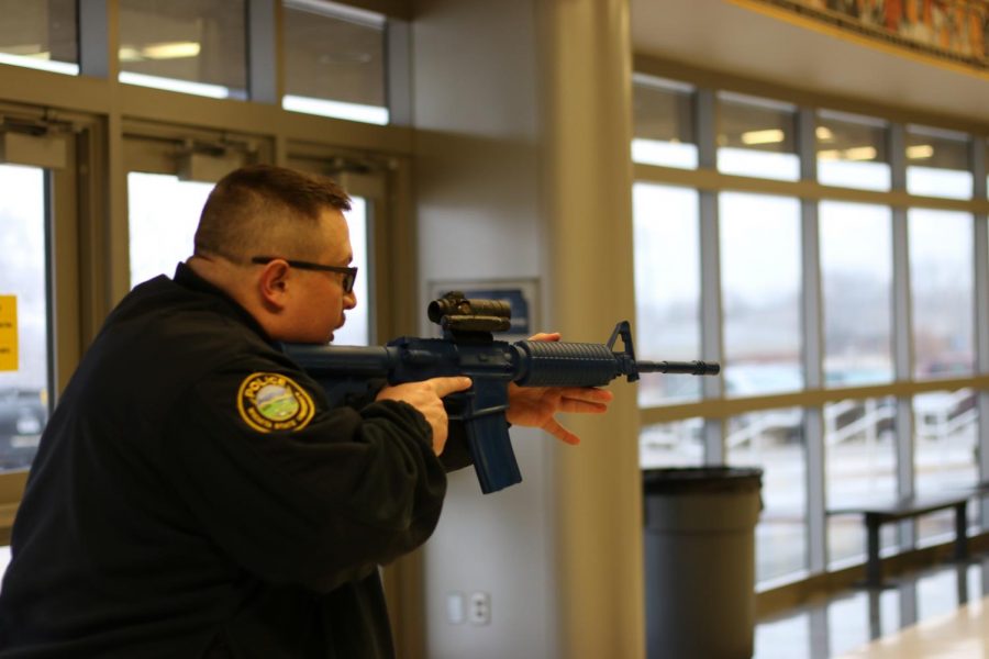 WSUPD officer engaging in active shooter training excercise. This excercise was performed inside Charles Koch arena.