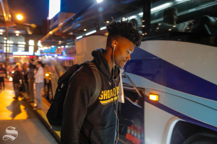 Rod Brown loads up on the bus on the way to the game on March 14, 2019. (Photo by Joseph Barringhaus/The Sunflower.)