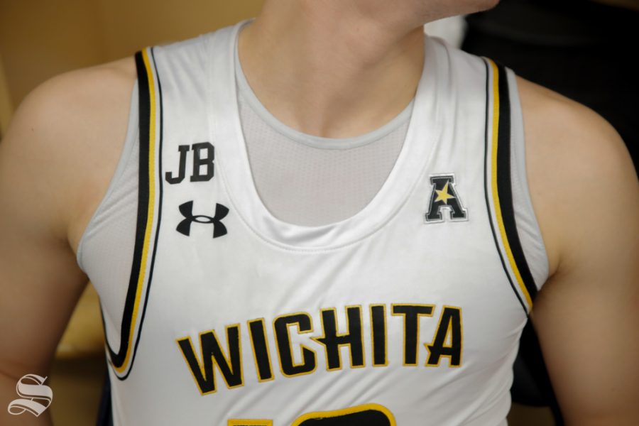 Wichita State paid tribute to former President John Bardo by adding a patch to its jeresys with his initials. Bardo died eariler this week. (Photo by Joseph Barringhaus / The Sunflower.)
