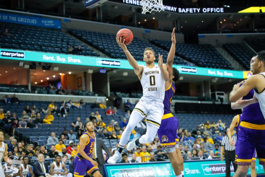 Wichita State guard Dexter Dennis reaches out for a shot during the second half of the game against East Carolina on March 14, 2019 at the FedExForum in Memphis, Tennessee. (Photo by Joseph Barringhaus/The Sunflower.)