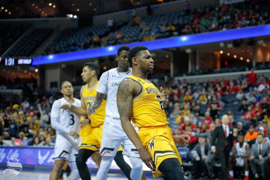 Wichita+State+freshman+Jamarius+Burton+reacts+to+his+dunk+during+the+first+half+of+the+game+against+Cincinnati+on+March+16%2C+2019+at+the+FedExForum+in+Memphis%2C+Tennessee.+%28Photo+by+Joseph+Barringhaus%2FThe+Sunflower%29.