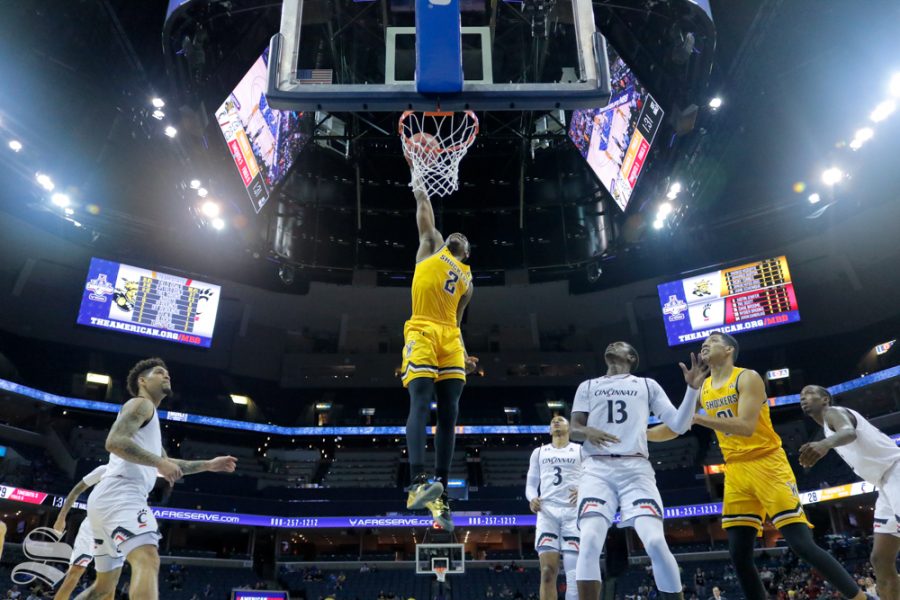Wichita+State+freshman+Jamarius+Burton+dunks+the+ball+during+the+first+half+of+the+game+against+Cincinnati+on+March+16%2C+2019+at+the+FedExForum+in+Memphis%2C+Tennessee.+%28Photo+by+Joseph+Barringhaus%2FThe+Sunflower%29.