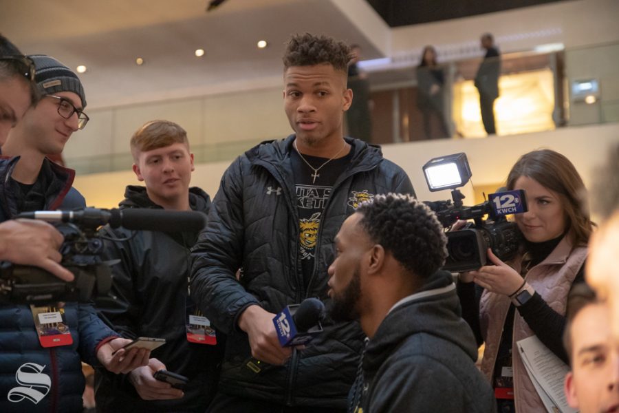 Wichita State freshman Dexter Dennis jokingly interviews senior Markis McDuffie in the New York Marriott Marquis on April 1, 2019. (Photo by Joseph Barringhaus/The Sunflower).