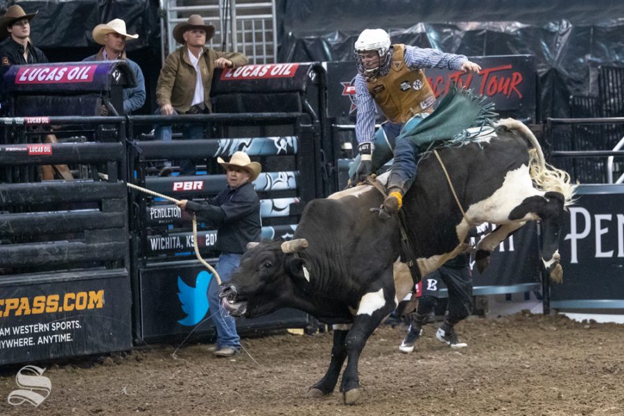 Josh Goodson holds onto Just Al for 3.51 seconds during the first round of the PBR Pendleton Whisky Velocity Tour on April 13, 2019 at INTRUST Bank Arena. (Photo by Joseph Barringhaus/The Sunflower).