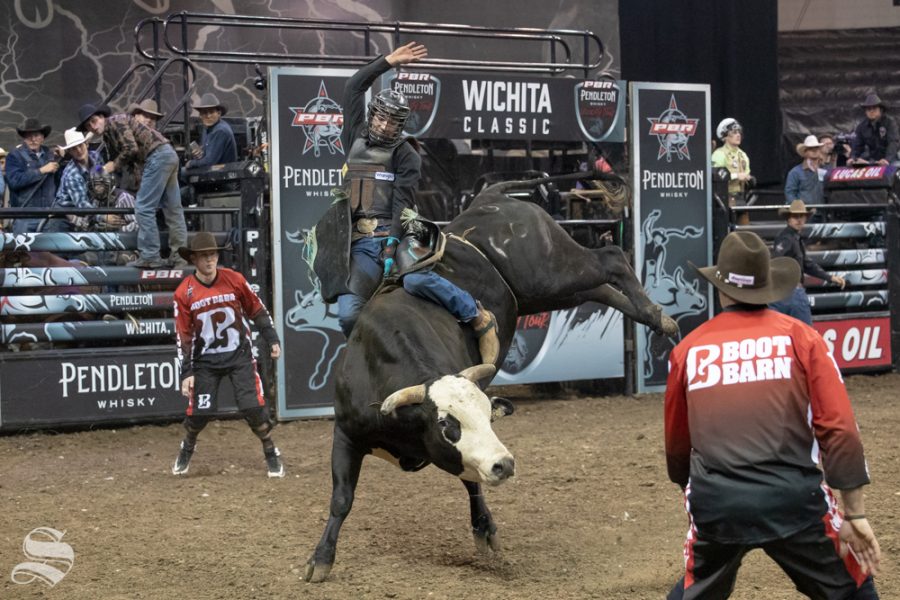 Elijah Mora holds onto Hammerhead Blue for 2.22 seconds during the first round of the PBR Pendleton Whisky Velocity Tour on April 13, 2019 at INTRUST Bank Arena. (Photo by Joseph Barringhaus/The Sunflower).
