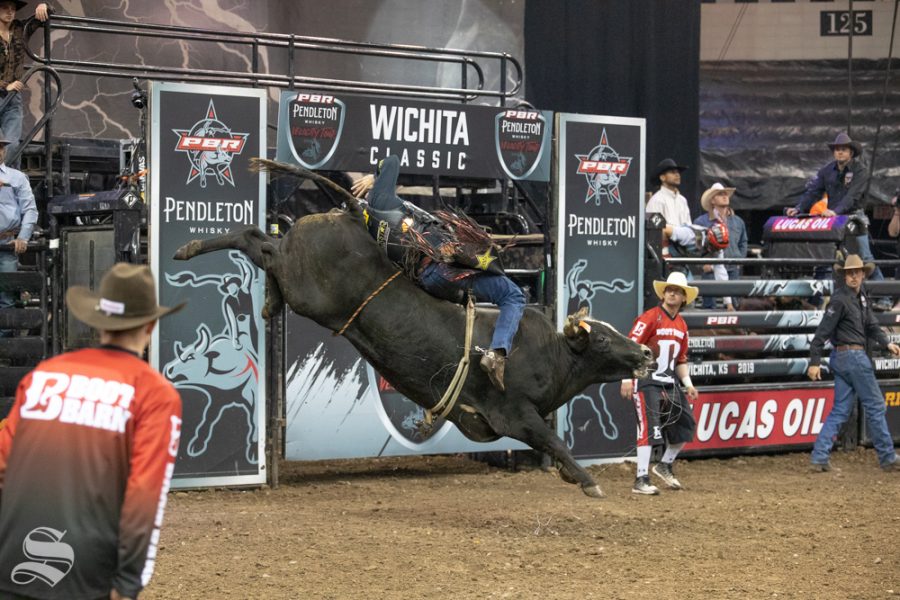 Ramon De Lima holds onto Im Legit Too for 3.24 seconds during the first round of the PBR Pendleton Whisky Velocity Tour on April 13, 2019 at INTRUST Bank Arena. (Photo by Joseph Barringhaus/The Sunflower).
