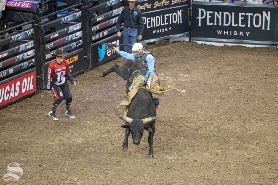 Eli Byler holds onto Gettin Crazy for 6.77 seconds during the first round of the PBR Pendleton Whisky Velocity Tour on April 13, 2019 at INTRUST Bank Arena. (Photo by Joseph Barringhaus/The Sunflower).