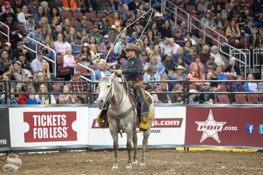 A Border Patrol agent stands by with his lasso waiting for the next bull and rider to come out of the chute during the first round of the PBR Pendleton Whisky Velocity Tour on April 13, 2019 at INTRUST Bank Arena. (Photo by Joseph Barringhaus/The Sunflower).