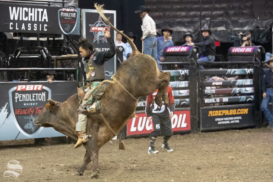 Garfield Wilson holds onto Betsy for 7.37 seconds during the first round of the PBR Pendleton Whisky Velocity Tour on April 13, 2019 at INTRUST Bank Arena. (Photo by Joseph Barringhaus/The Sunflower).