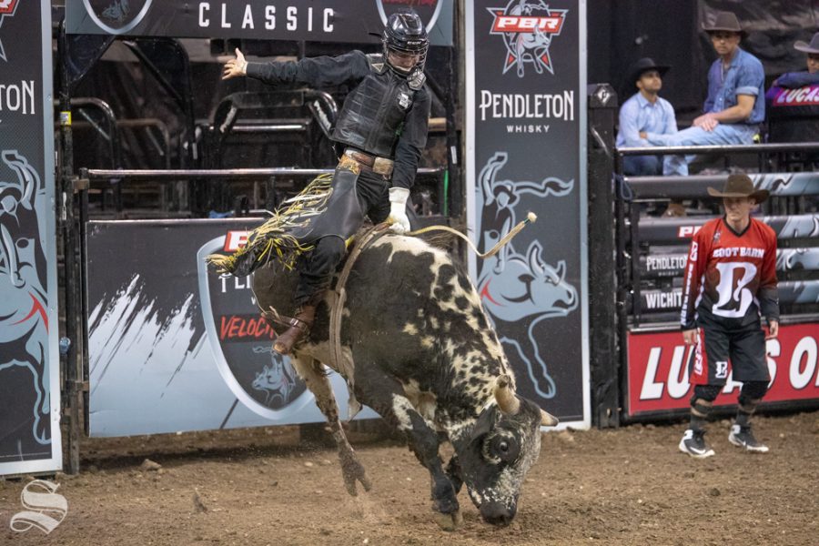 Jake Lockwood holds onto Hot Spot for 5.70 seconds during the first round of the PBR Pendleton Whisky Velocity Tour on April 13, 2019 at INTRUST Bank Arena. (Photo by Joseph Barringhaus/The Sunflower).