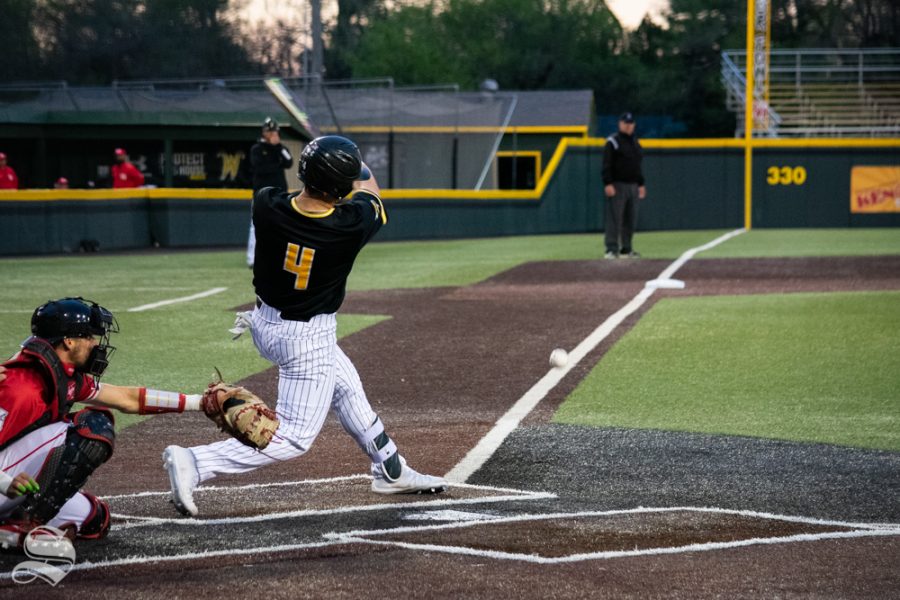 Wichita States Jordan Boyer swings for the ball during their game against University of Houston on Friday, April 12. (Photo by Easton Thompson/The Sunflower).