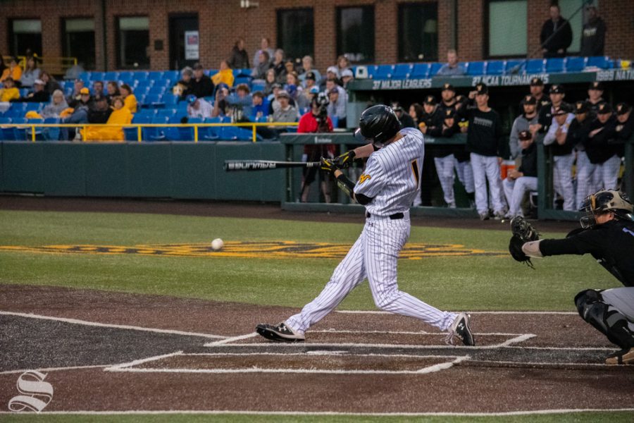 Wichita States Brady Slavens swings for the ball during their game against University of Central Florida. (Photos by Easton Thompson / The Sunflower).