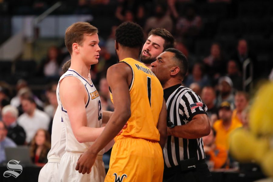 Wichita State senior Markis McDuffie exchanges words with Lipscomb forward Matt Rose during the second half of the game on April 2, 2019 at Madison Square Garden in New York. (Photo by Joseph Barringhaus/The Sunflower).