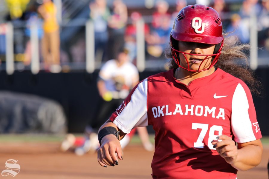 Oklahomas Jocelyn Alo returns to third base after a tag out at first base. No. 1 Oklahoma defeated Wichita State 8-0 in five innings on April 24 at Wilkins Stadium. (Photo by Evan Pflugradt/The Sunflower).